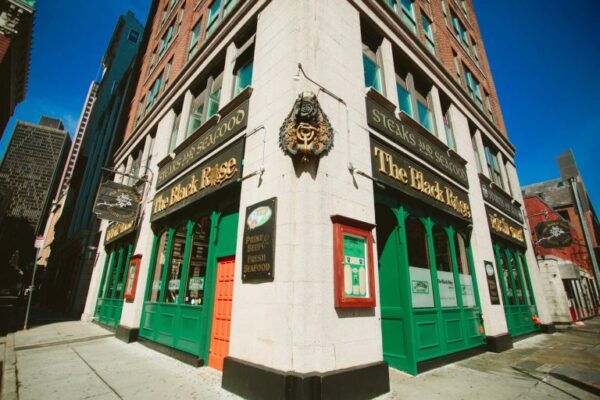 street corner in boston with the green doors bar located inside this corner